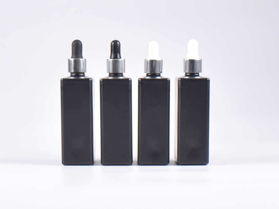 Schwarzglasflasche "Miro" 100ml, mit Pipette silber glanz