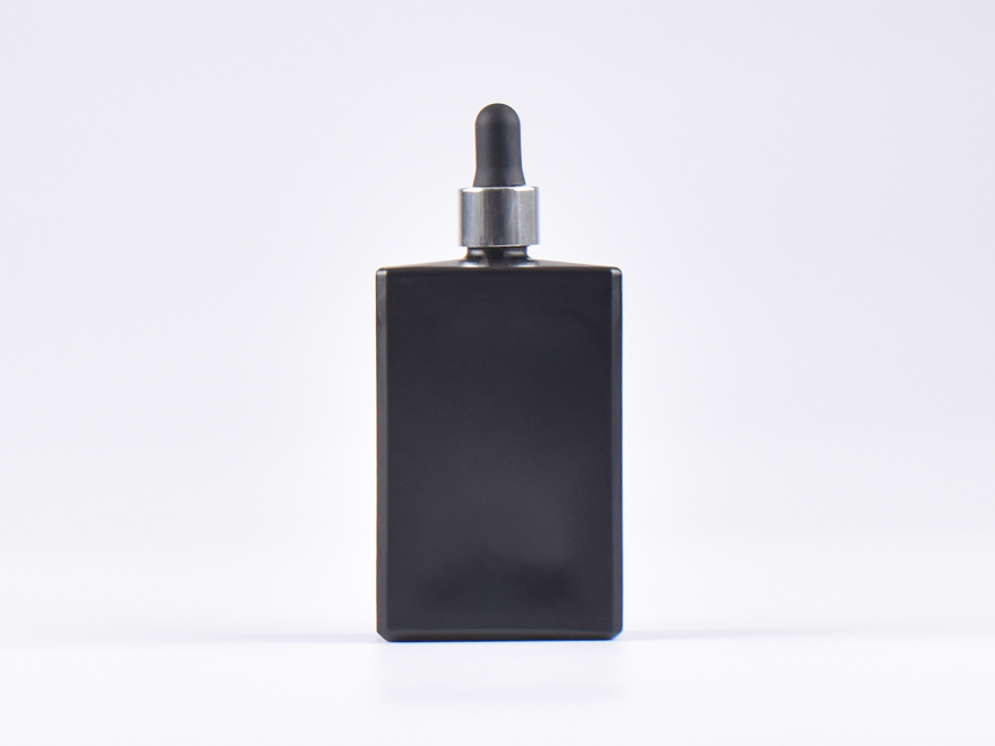 Schwarzglasflasche "Miro" 100ml, mit Pipette silber glanz
