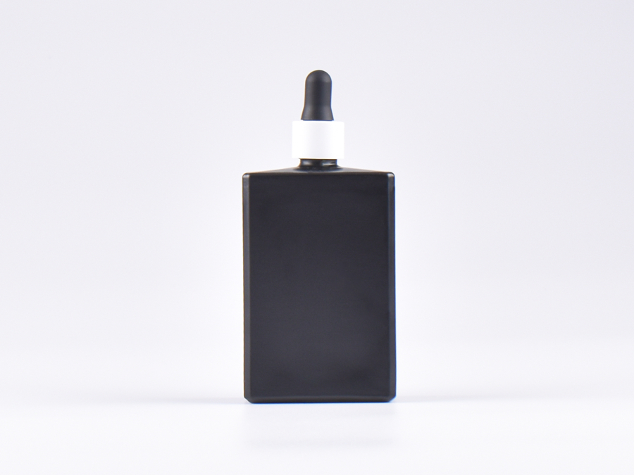 Schwarzglasflasche "Miro" 100ml, mit Pipette weiss