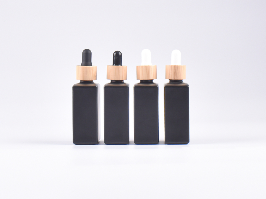 Schwarzglasflasche "Miro" 50ml, mit Pipette Bambus