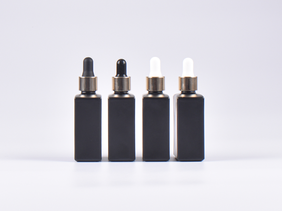 Schwarzglasflasche "Miro" 50ml, mit Pipette gold