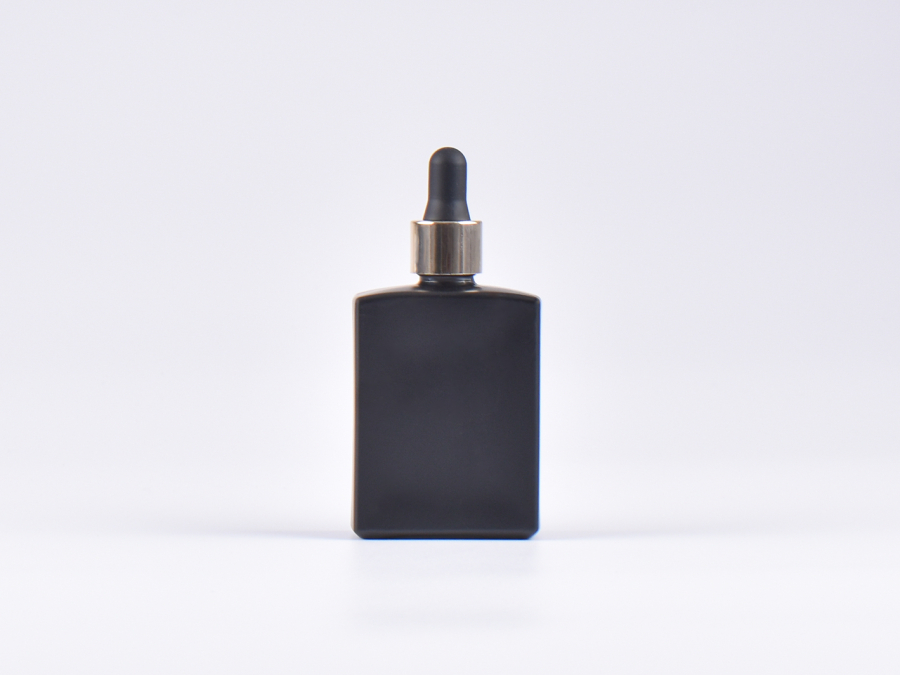 Schwarzglasflasche "Miro" 50ml, mit Pipette gold