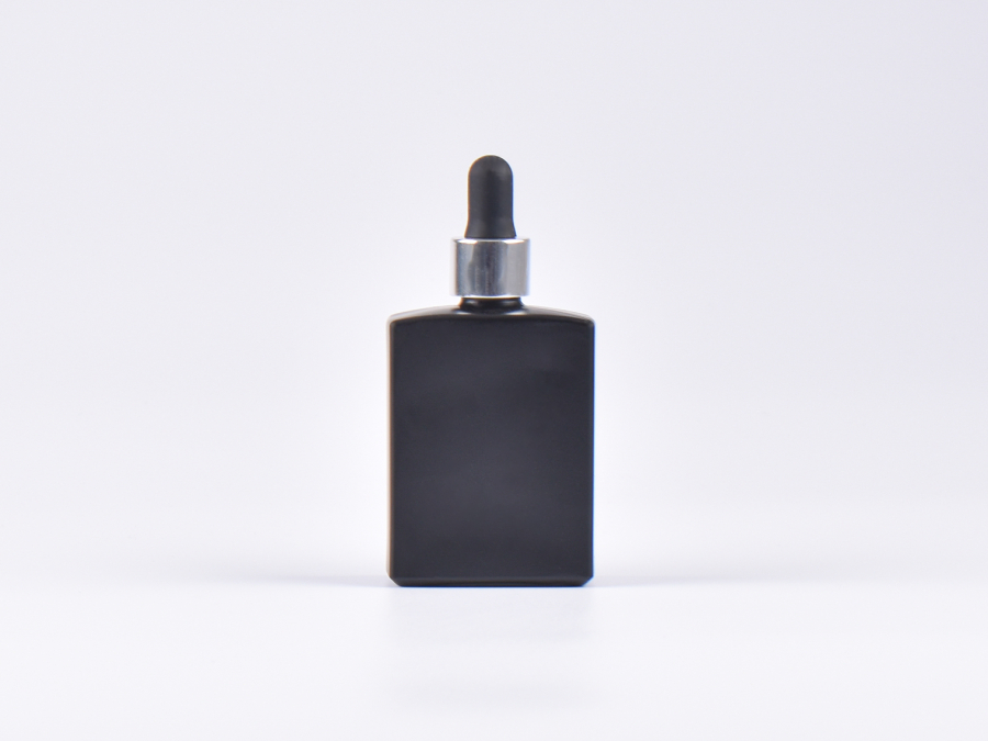 Schwarzglasflasche "Miro" 50ml, mit Pipette silber glanz