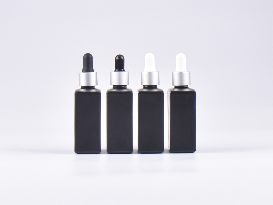 Schwarzglasflasche "Miro" 50ml, mit Pipette silber matt