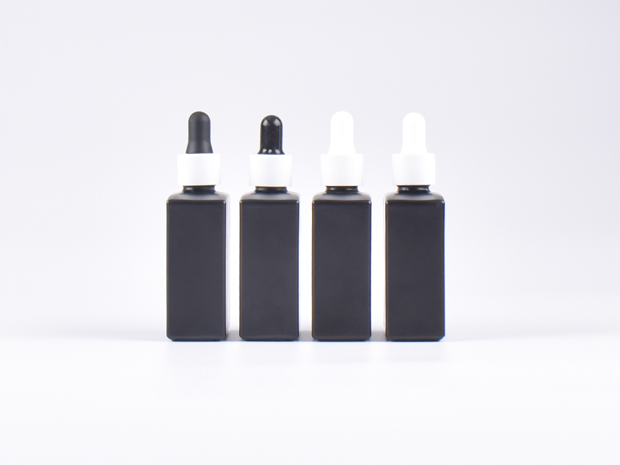 Schwarzglasflasche "Miro" 50ml, mit Pipette weiss