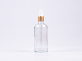 Klarglasflasche 100ml, mit Pipette gold