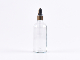 Klarglasflasche 100ml, mit Pipette gold