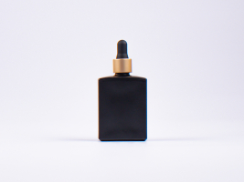 Schwarzglasflasche "Miro" 50ml, mit Pipette gold