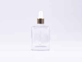 Klarglasflasche "Miro" 50ml, mit Pipette gold