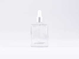Klarglasflasche "Miro" 50ml, mit Pipette silber matt