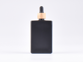 Schwarzglasflasche "Miro" 100ml, mit Pipette Bambus