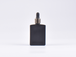 Schwarzglasflasche "Miro" 50ml, mit Pipette gold