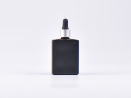 Schwarzglasflasche "Miro" 50ml, mit Pipette silber matt